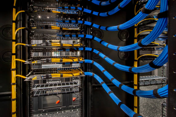fiber optic and cat 6 wiring in a server room. fiber optic and cat 6 wiring in a server room.